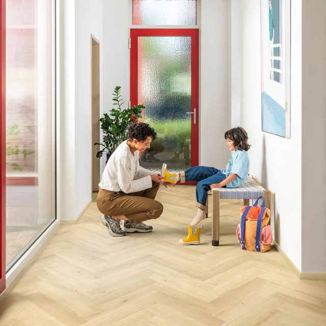 Padre e hijo sobre laminado en espiga Quick-Step Impressive Design